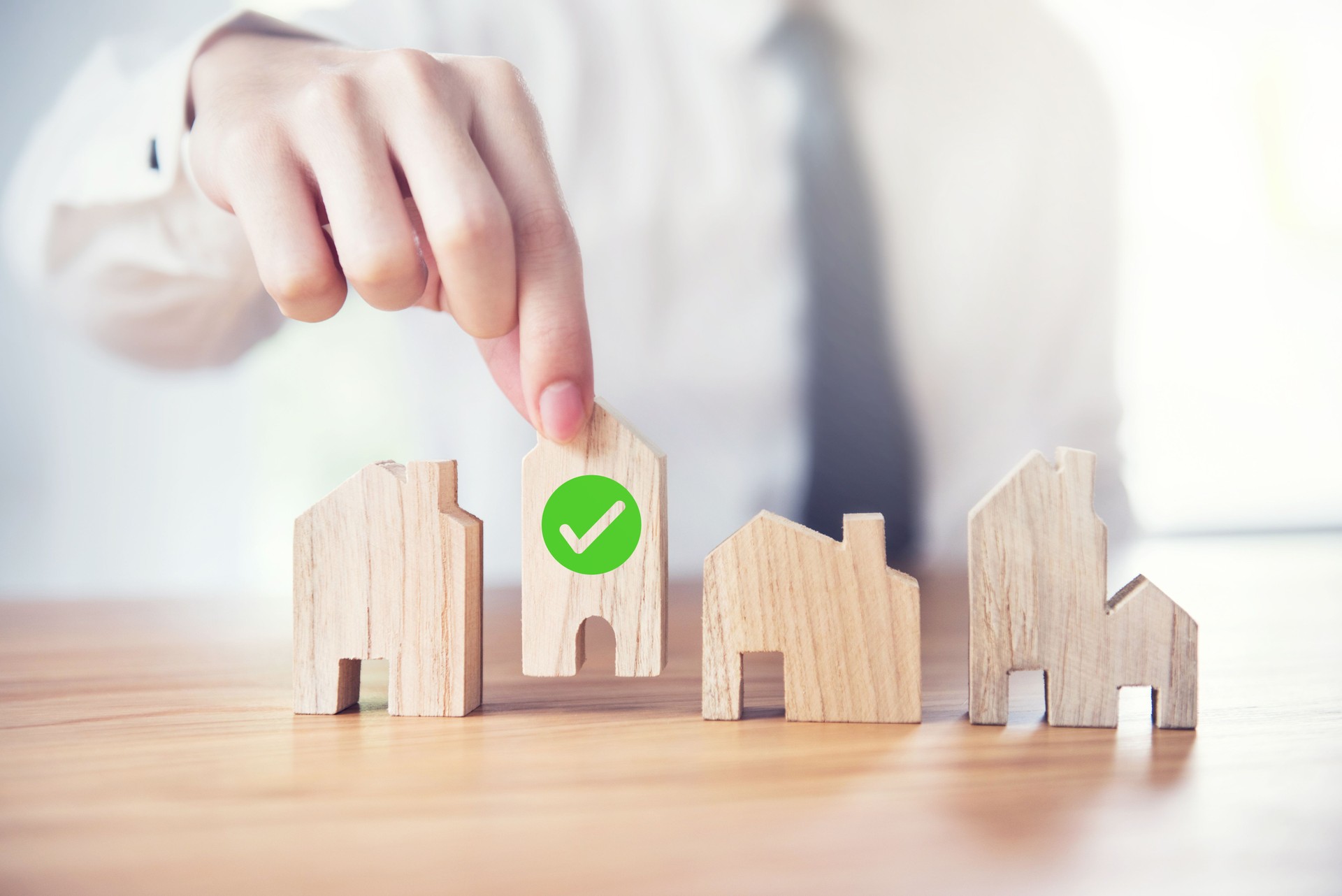 Businessman choosing house model with icon check mark, Choose what's the best, Planning buy Real Estate.